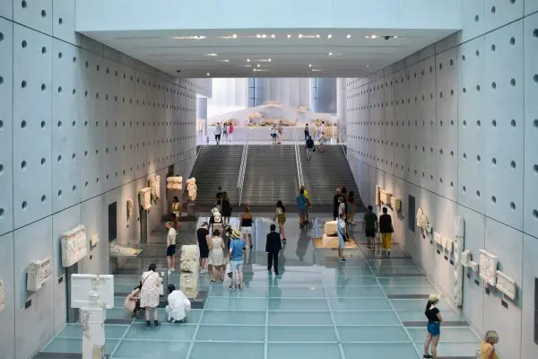 An area of the acropolis museum with artifacts lining the walls