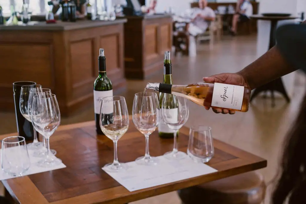 Waiter serving wine for a wine tasting in Cape Town